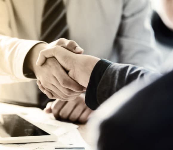 A handshake sealing a partnership